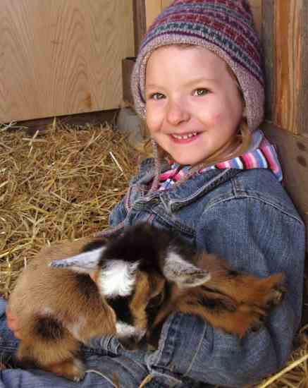 
Reader Lily Hempt’s daughter cuddles a newborn kid.
